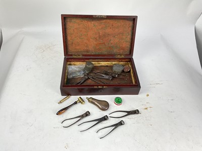 Lot 957 - Victorian mahogany pistol box with various bullet moulds, cap tins, flask etc