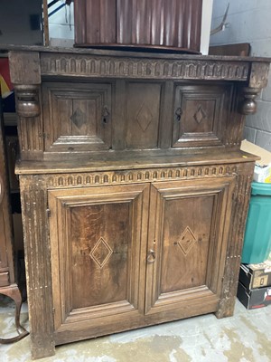 Lot 1128 - 17th century and later oak, Holly and bog oak inlaid court cupboard