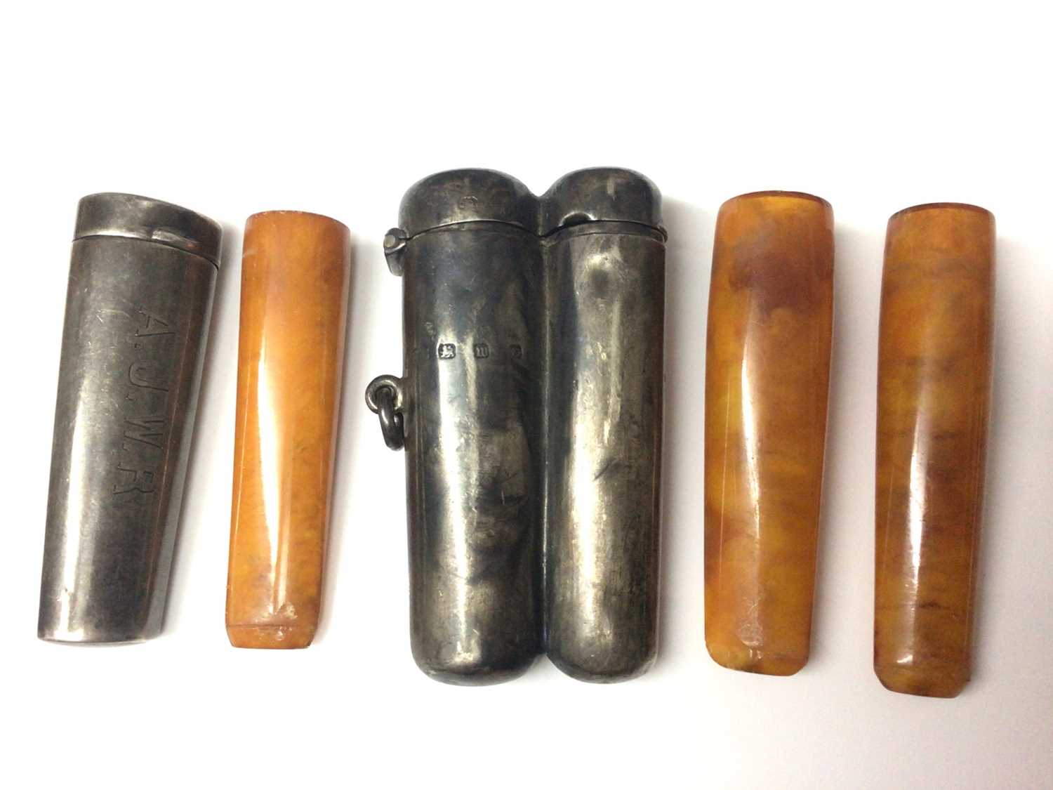 Lot 161 - Victorian silver double cheroot holder and one single silver cheroot holder, both containing amber cheroots