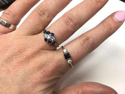 Lot 169 - 18ct gold diamond and sapphire three stone ring, together with 9ct gold diamond and synthetic blue stone cluster ring