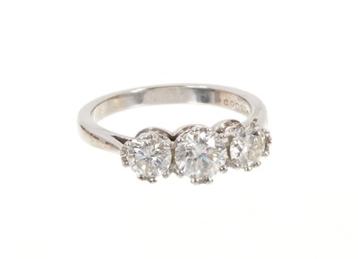 Lot 430 - Diamond three stone ring with three round brilliant cut diamonds in claw setting on platinum shank. Estimated total diamond weight approximately 1.22cts. Hallmarked Sheffield 2003.
