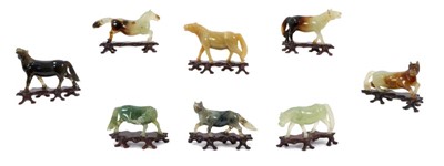 Lot 1025 - Set of eight early 20th century Chinese jade horses, with purchase receipt from a Singapore Antique shop dated 1960 and a 1965 insurance valuation.