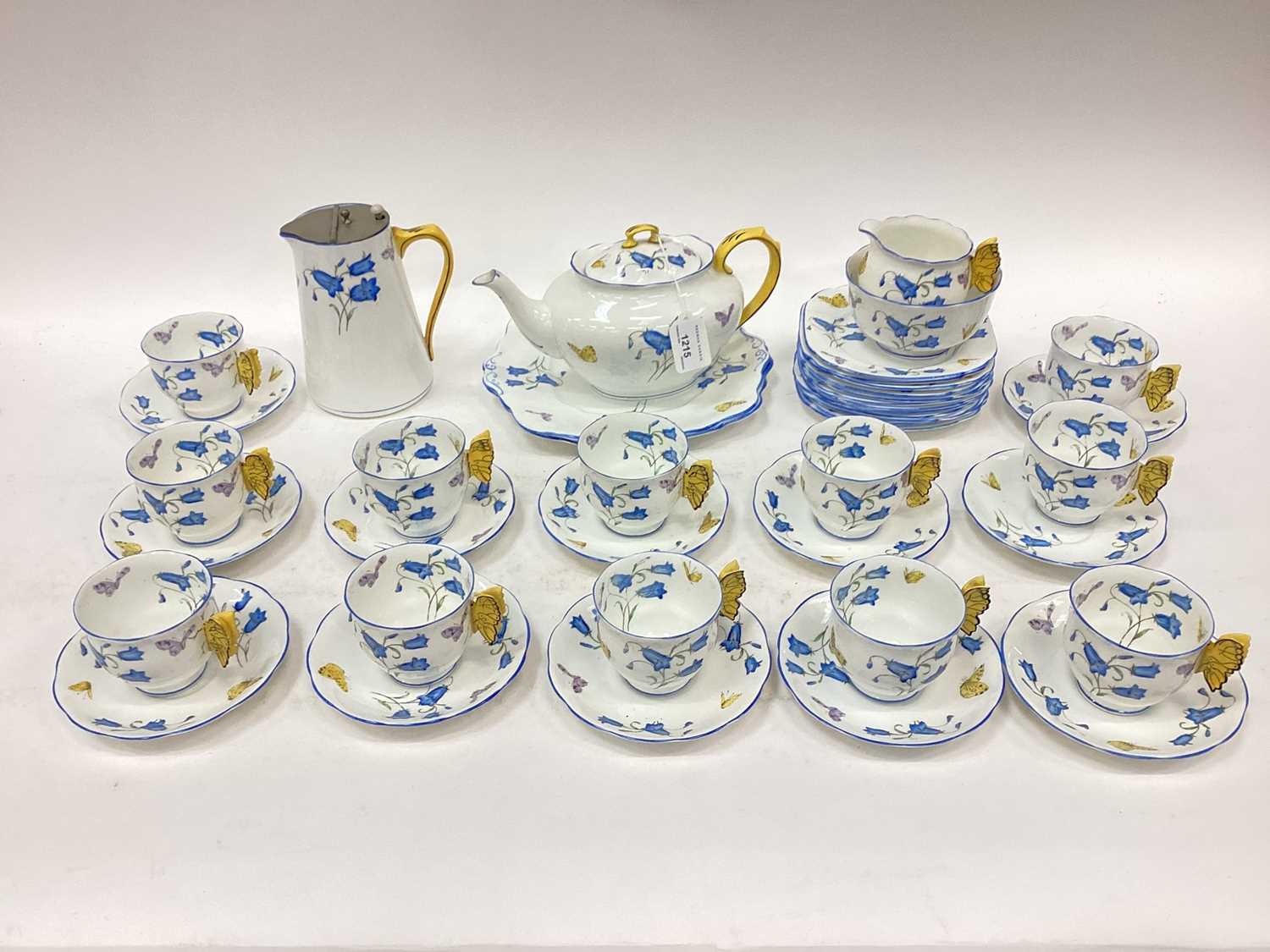 Lot 1215 - 1930s Royal Albert twelve place teaset decorated with flowers and moulded butterfly handles.