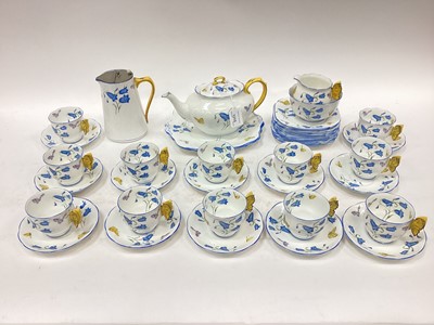Lot 1215 - 1930s Royal Albert twelve place teaset decorated with flowers and moulded butterfly handles.