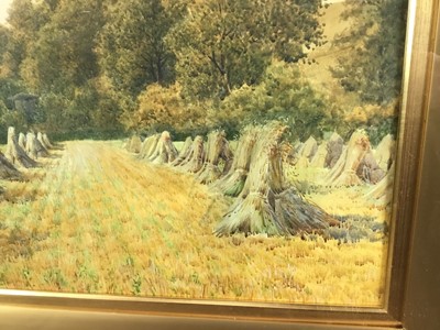 Lot 179 - Charles L. Saunders (?-1915) watercolour - The Hay Stooks, signed, 44cm x 75cm, in glazed gilt frame