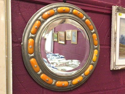 Lot 329 - Eastern silver plated circular wall mirror set with simulated amber