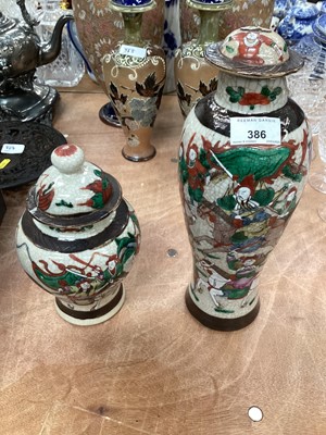 Lot 386 - Pair of Japanese vases and covers