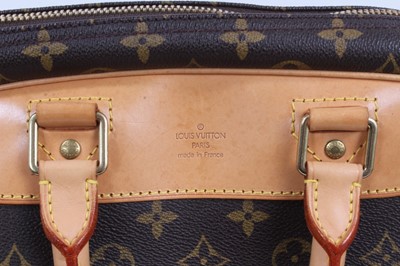 Lot 2090 - Louis Vuitton travel bag with signature monogrammed design and leather handles, together with a Louis Vuitton padlock and key, and. Versace umbrella