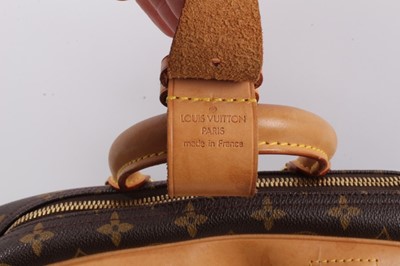 Lot 2090 - Louis Vuitton travel bag with signature monogrammed design and leather handles, together with a Louis Vuitton padlock and key, and. Versace umbrella