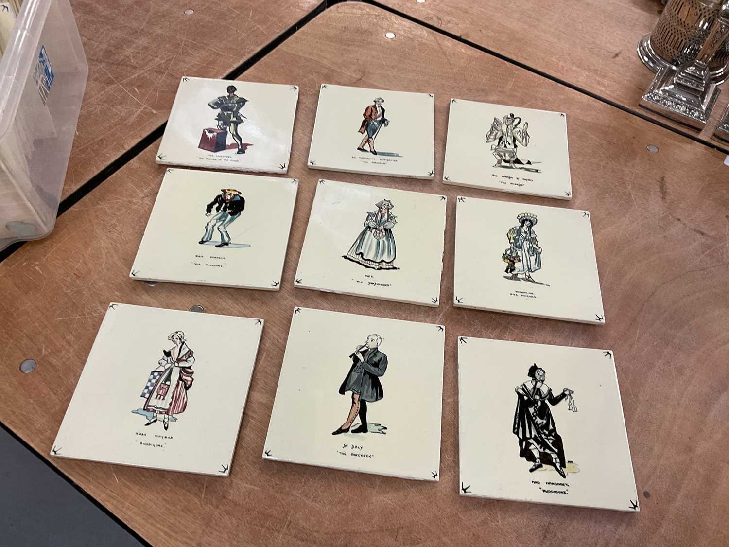 Lot 384 - Collection of tiles decorated with characters from Gilbert & Sullivan operas.