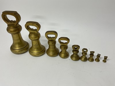 Lot 280 - Set of nine brass butchers' weights