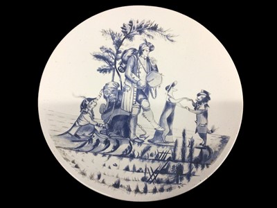 Lot 20 - Pottery charger of humorous design depicting minstrel with dancing bear and animals, signed with initials