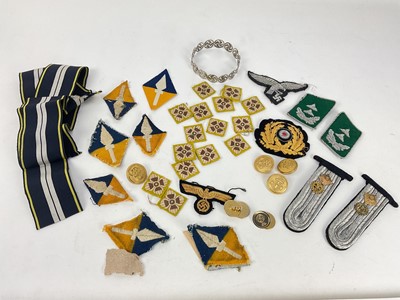 Lot 504 - George V silver Swastika bangle (Birmingham 1923), together with a group of replica Nazi and other cloth patches and badges.