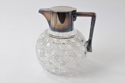 Lot 226 - Edwardian cut glass and silver plated claret jug of globular shape