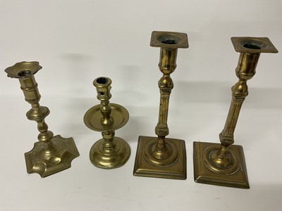 Lot 277 - Pair of Bell metal candlesticks on square bases, single 18th century candlestick, single 18th century candlestick with drip tray