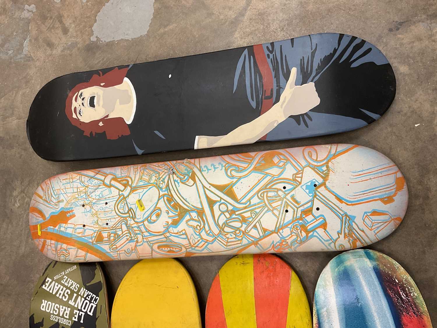 Lot 2457 Ten skateboard tops of various designs