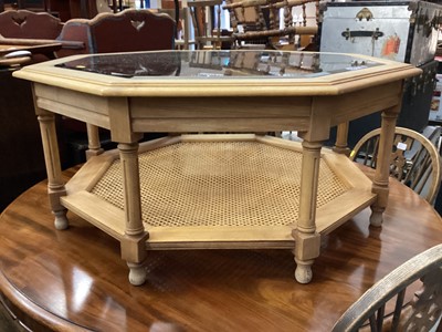 Lot 1044 - Octagonal coffee table with glass top on turned and block legs with caned undertier, 97cm wide, 43cm high