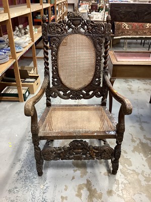 Lot 1045 - Late Victorian heavily carved oak elbow chair with cane seat and back, and spiral twist supports, 68cm wide, 58cm deep, 122cm high