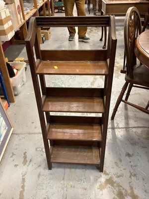 Lot 1046 - Narrow oak open bookcase, 37cm wide, 15.5cm deep, 94cm high, together with an oak three tier folding cake stand (2)