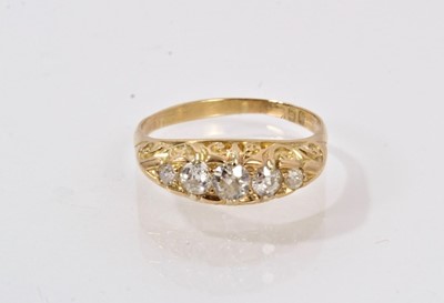 Lot 505 - Edwardian diamond five stone ring with five old cut diamonds in carved gold setting on 18ct gold shank, London 1905.
