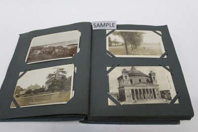 Lot 1411 - Postcards in album including real photographic street scenes,horses and carts, military...