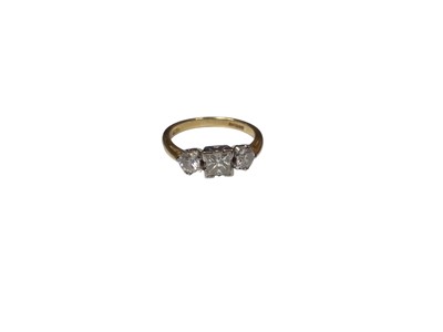 Lot 245 - Diamond three stone ring with a central princess cut diamond flanked by two brilliant cut diamonds on 18ct gold shank