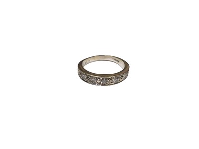 Lot 246 - Diamond seven stone half hoop eternity ring in 18ct white gold illusion setting