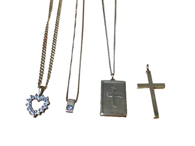 Lot 254 - 9ct gold Bible locket pendant on chain, two 9ct gold diamond set pendants on chains and a 9ct gold cross pendant