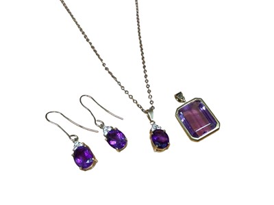 Lot 255 - 18ct gold amethyst and diamond pendant on 9ct gold chain, pair of matching earrings and an amethyst single stone pendant