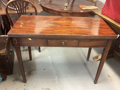 Lot 1098 - George III mahogany tea table with fold-over top, single drawer and inlaid stringing on square taper legs