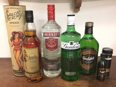 Lot 323 - Five bottles of spirits to include Sailor Jerry spiced rum 70cl, Smirnoff vodka 1litre, Gordon's gin 70cl, Glenfiddich scotch whisky 50cl and a miniature 5cl