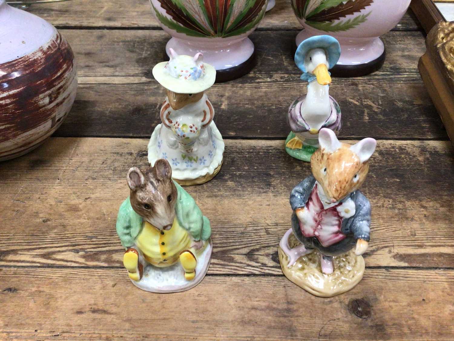 Lot 31 - Four Beatrix Potter figures, including two Beswick and two Royal Doulton