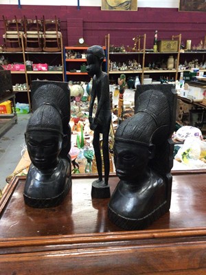 Lot 44 - A pair of carved African wood bookends, a figure, and a box of marbles