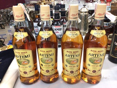 Lot 319 - Four bottles of Artemi liqueur honey rum, 1litre