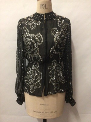 Lot 2095 - Designer Thea Porter Couture 1970s black crepe chiffon evening top with gathered waist and wide sleeves with cuffs,size 8,  1960's pink beaded tunic and 1960's Chinese brocade evening jacket.