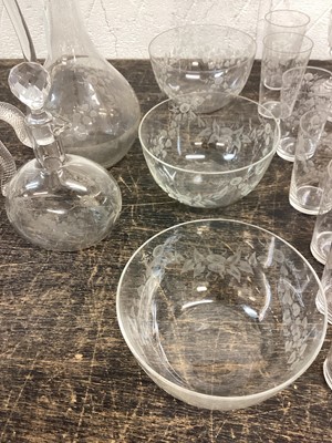 Lot 1219 - A good Baccarat service of drinking glasses, decanters and finger bowls, finely etched with floral swags