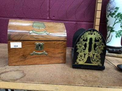 Lot 664 - A Victorian walnut domed top brass mounted stationary box, and a brass mounted coromandel book slide (2)