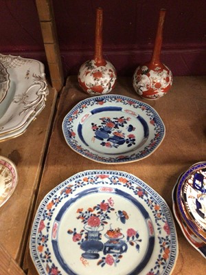 Lot 671 - A pair of Chinese famille rose export plates, and a pair of Japanese Kutani vases (4)