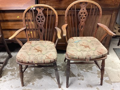 Lot 1142 - Two 19th century wheelback elbow chairs on turned legs joined by stretchers