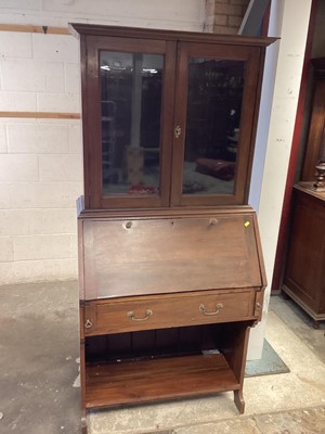 Lot 1143 - Early 20th century walnut two height escritoire with two glazed doors above, writing compartment, single drawer and shelf below, 86cm wide, 46cm deep, 183cm high