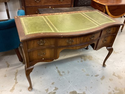 Lot 1144 - Walnut veneered serpentine fronted kneehole writing table with inset leather lined top, five drawers below on cabriole legs, 123cm wide, 60cm deep, 76cm high