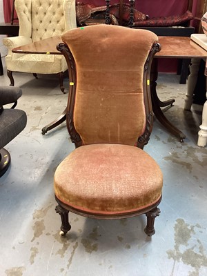 Lot 1149 - Victorian mahogany framed nursing chair with peach upholstery on fluted turned front legs and ceramic castors