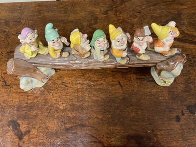 Lot 172 - Doulton Figural group of Disney's seven dwarfs, together with Doulton figure of a horse and a Royal Crown Derby pheasant paperweight