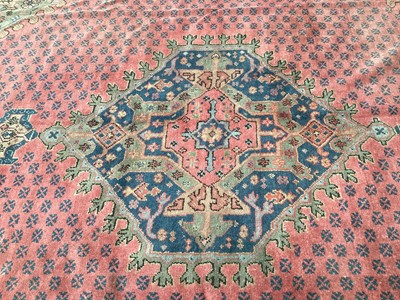 Lot 1159 - Large Turkey pattern rug with central medallion on red, blue and green ground, 408cm x 343cm