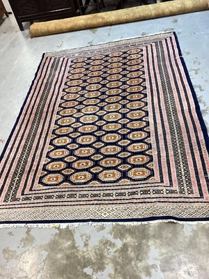 Lot 1160 - Eastern rug with geometric decoration on blue, orange, pink and cream ground, 266cm x 190cm