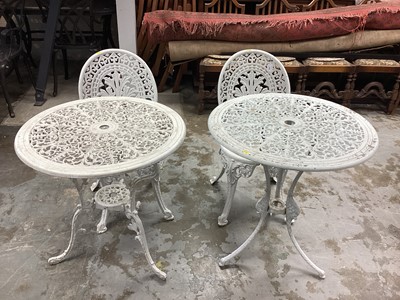 Lot 1167 - Two wrought iron circular garden tables together with two chairs (4)