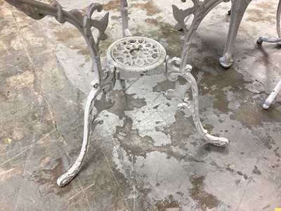 Lot 1167 - Two wrought iron circular garden tables together with two chairs (4)