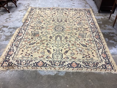 Lot 1190 - Rug with floral decoration on beige and blue ground, 264cm x 221cm