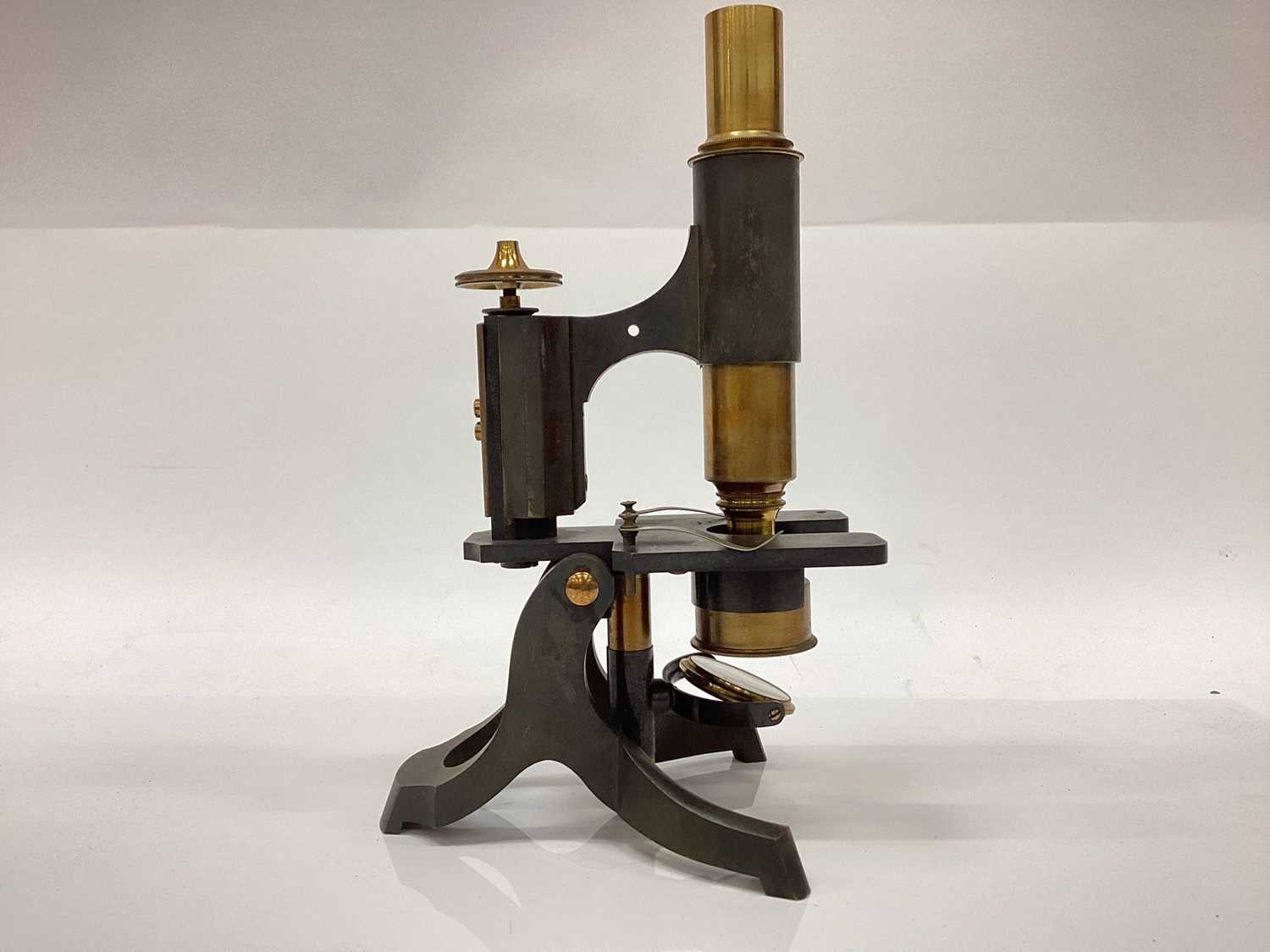 Lot 2510 - Early 20th century brass microscope, with lenses in fitted box