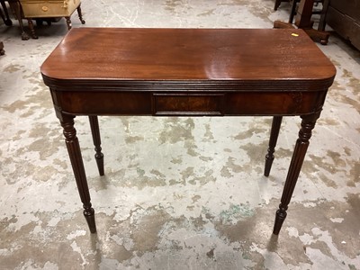 Lot 1193 - 19th century mahogany tea table with foldover top on receded turned legs, 91cm wide, 44cm deep, 75cm high